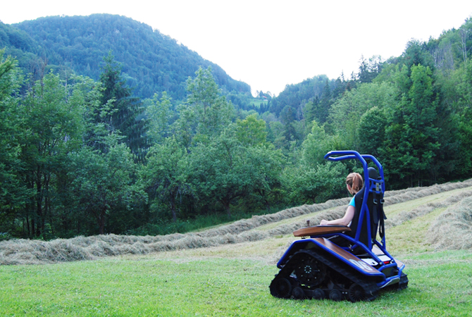 Me driving the electric rubber-tracked vehicle Ziesel on our mountain farm in Styria (2016)